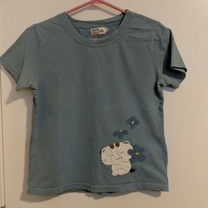 Short sleeved blue top with cute white cat